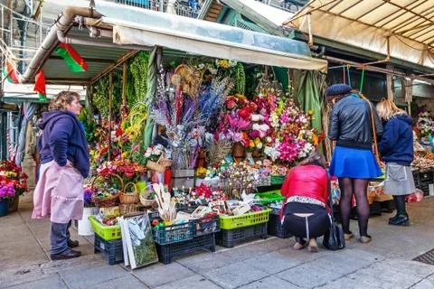 Artificial flowers stand in the interior of the historical Bolhao Market Stock Photos