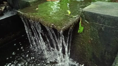 The artificial fountain in the fish pond Stock Footage 274377970