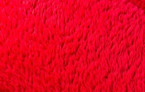 Artificial fur red background texture fabric felt Foto stock