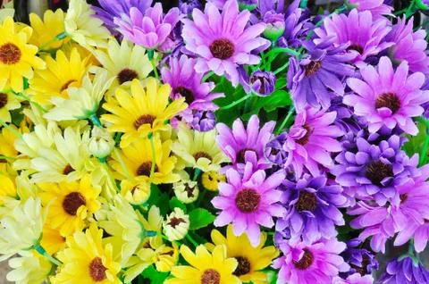 Artificial gerbera flowers background Stock-Fotos