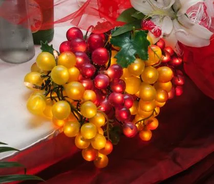 Artificial grapes glowing Stock Photos