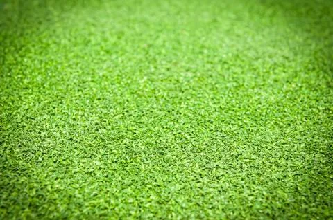 Artificial grass background with vignetting added. Stock Photos