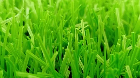 Artificial grass footage showing forward movement with realistic textures Stock Footage 313820011
