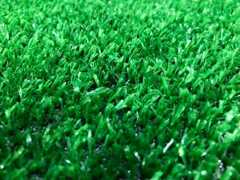 Artificial green grass closeup. Stock Photos