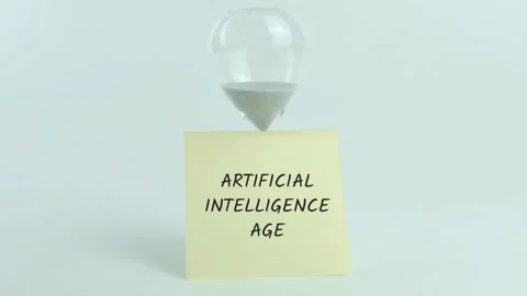 Artificial Intelligence Age written on yellow sticky note placed on hourglas Stock Footage 313460885