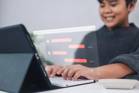 Artificial intelligence AI transforms learning as a young boy interacts wit.. Foto stock