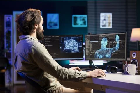 Artificial intelligence becoming sentient, greeting IT expert at desk Stock Photos