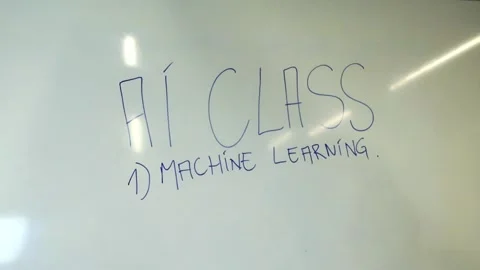 Artificial intelligence class with machine learning written on whiteboard 動画素材 346487392