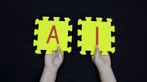 Artificial intelligence concept hands displaying foam alphabet tiles for ai Stock Footage 319024735