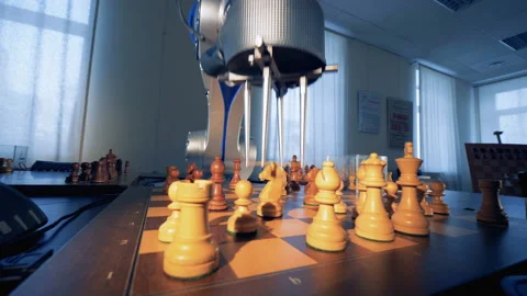 Artificial intelligence concept. Innovative modern robotic arm playing chess Video stock 86057610