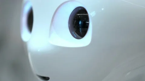 Artificial intelligence. Futuristic humanoid funny robot moves its head and eyes Stock Footage 221411527