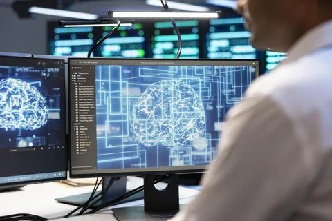 Artificial intelligence, programmer and brain on monitor for analysis Stock Photos