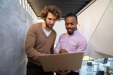 Artificial intelligence, programming innovation. Teamwork with laptops for Stock Photos