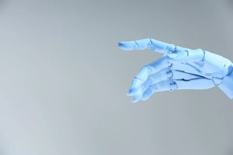 Artificial intelligence. Robot hand gesturing on grey background, space for.. Stock Photos