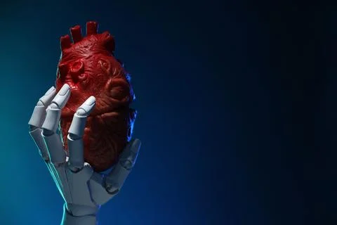Artificial intelligence. Robot hand holding model of human heart on dark bl.. Stock Photos