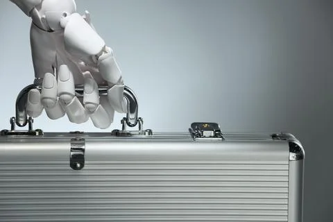 Artificial intelligence. Robot hand with metal case on grey background, close Stock Photos