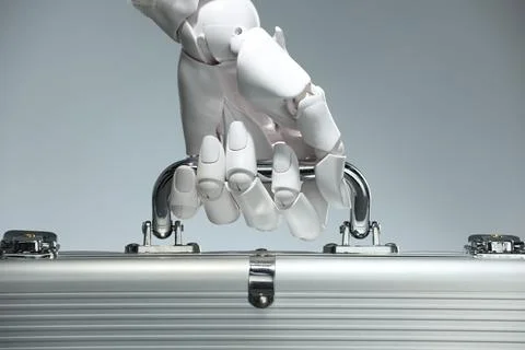 Artificial intelligence. Robot hand with metal case on grey background, close Stock Photos