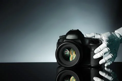 Artificial intelligence. Robot hand with photo camera against grey backgrou.. Stock Photos