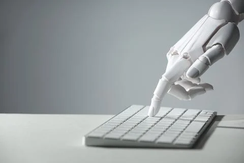 Artificial intelligence. Robot hand using keyboard at light table against g.. 스톡 사진