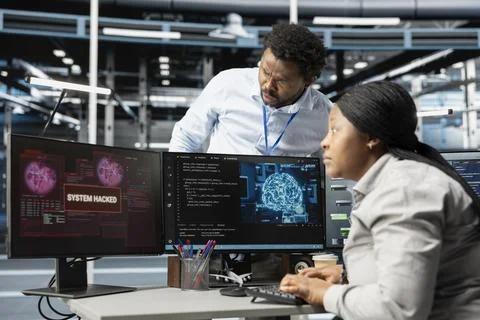 Artificial intelligence server hub facility workers trying to protect servers Stock Photos