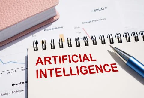 ARTIFICIAL INTELLIGENCE text written on notepad with pen on financial docum.. Stock Photos