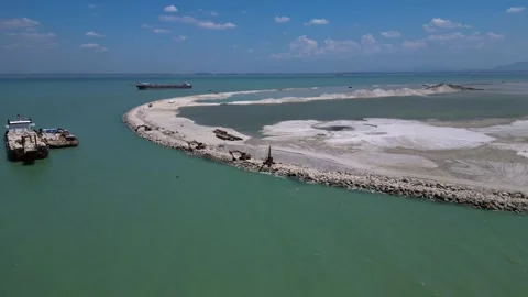 Artificial island reclamation construction excavator. Perfect aerial view drone Stock Footage 344607124