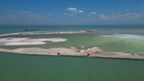 Artificial island reclamation construction excavator. Best aerial view drone Stock Footage 344610284