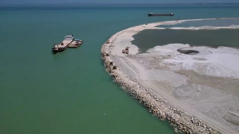 Artificial island reclamation construction excavator. Magic aerial view drone Stock Footage 344610670