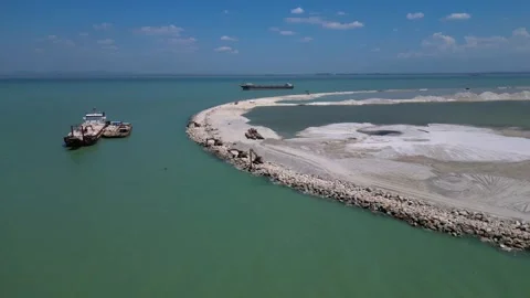 Artificial island reclamation construction excavator. Unique aerial view drone Stock Footage 344611695