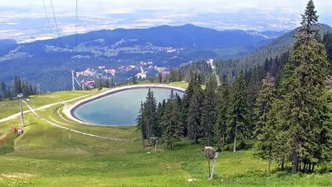 Artificial lake and Communications tower and cable cars in Sinaia Romania Stock Footage 102225830