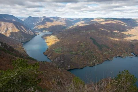 Artificial lake Perucac surrounded with mountains Фото