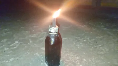 Artificial lamp from used bottles filled with kerosene Stock Footage 312704638