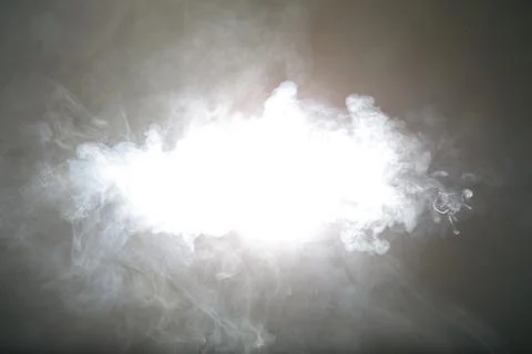 Artificial magic light illuminates smoke on dark background Foto stock