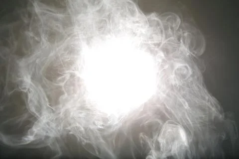 Artificial magic light illuminates smoke on dark background Stock Photos