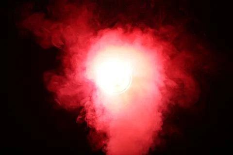 Artificial magic smoke in red light on black background Stock Photos