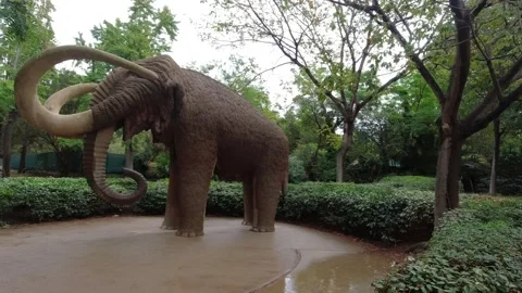An artificial mammoth statue in the Parc de la Ciutadella in Barcelona, Spain Stock Footage 248419825