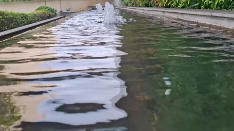 Artificial mini waterfall in the house garden Stock Footage 314597523