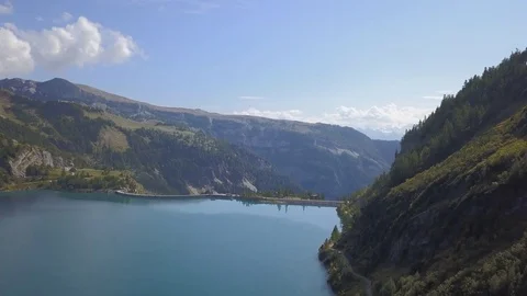 Artificial mountain lake in the Alps Stock Footage 84759789