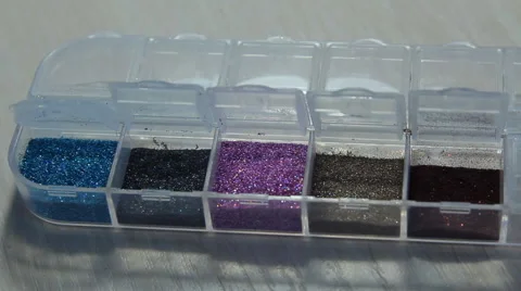 Artificial nails multicolored paint nail manicure multicolored sequins container Stock Footage 63457699