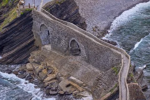 Artificial path to the hermitage of San Juan de Gaztelugatxe island Stock Photos