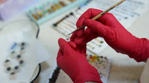 Artificial plastic human eye in doctor's hands. Eyes transplantation. Stock Footage 147099220