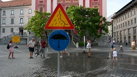 Artificial rain on the square to refresh the citizens. Rain sign. Stock Footage 312358178