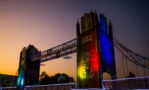 Artificial river bridge covered in lights in diwali fair Foto stock