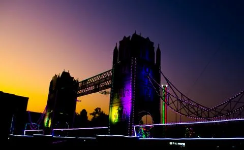 Artificial river bridge covered in lights in diwali fair 스톡 사진