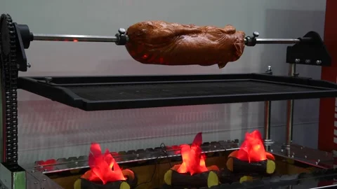Artificial roasted piglet on skewer Stock Footage 286326797