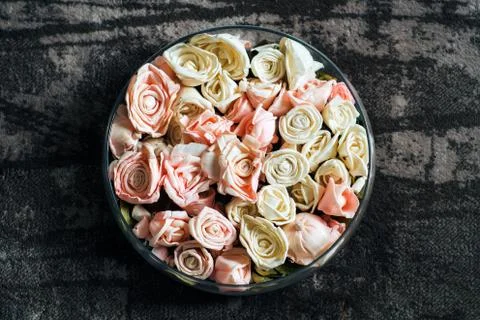 Artificial roses in a dish Stock Photos