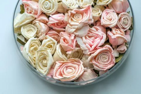 Artificial roses in a dish Foto stock