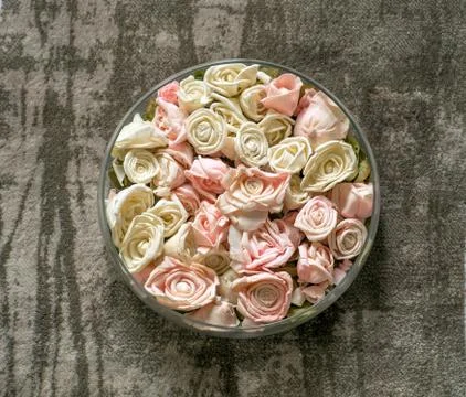 Artificial roses in a dish Foto stock