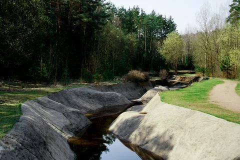 An artificial rowing channel created in the forest. Green area Stock Photos