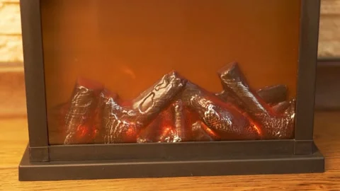 Artificial Safe Fireplace, Closeup. Flame Of The Fire Of An Artificial Fireplace Stock Footage 157545521